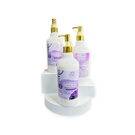 Three bottles of Asian Sakura Body Milk on a white stand with a white background
