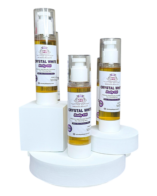 Set of Crystal White body oils on a white stand with a white background