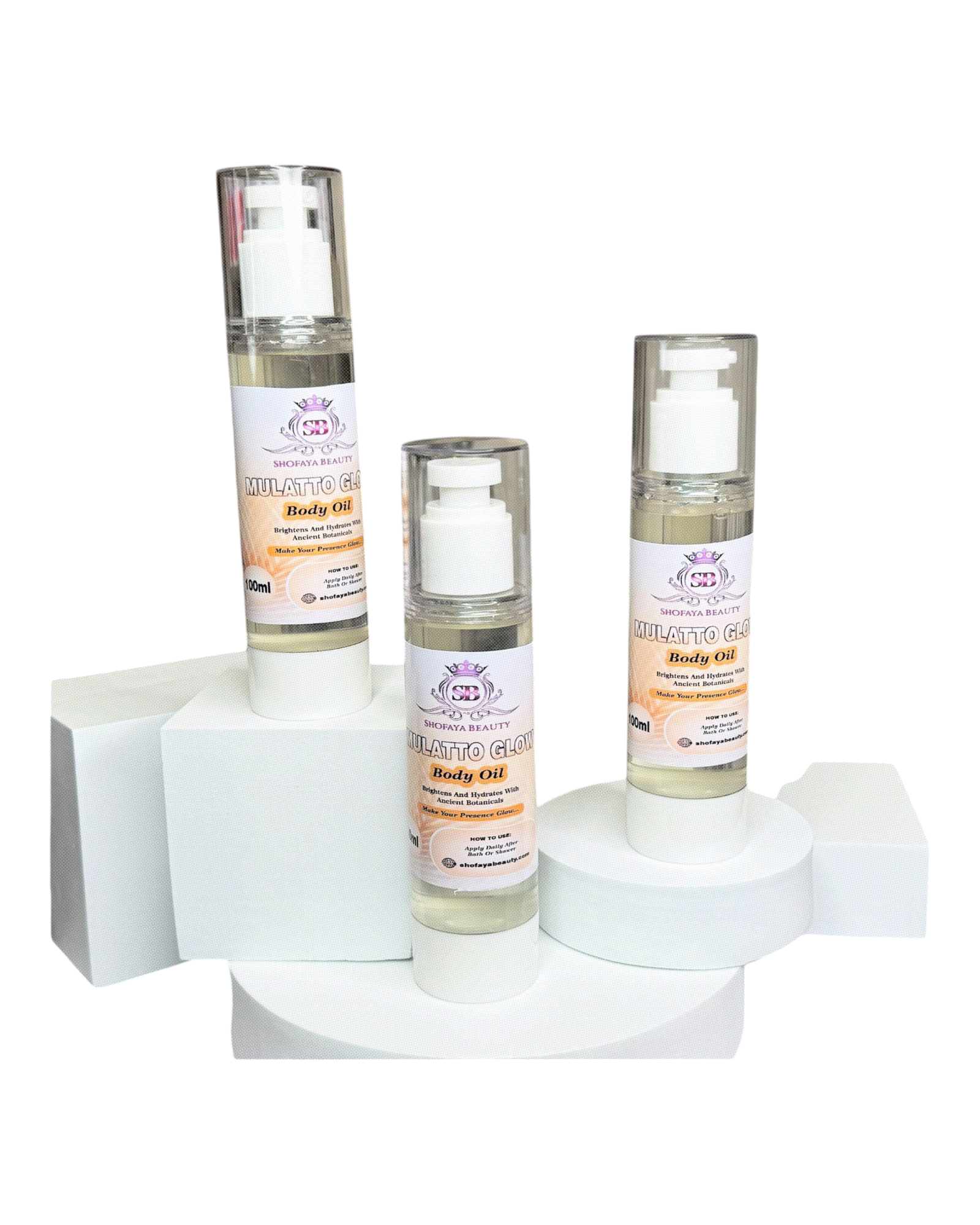 Three bottles of body oil on a white background