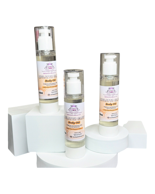 Three bottles of body oil on a white background
