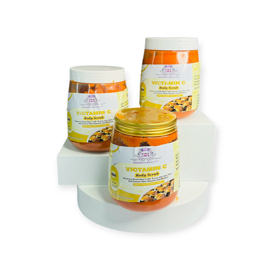 Three jars of Vitamin C body scrub on a white background